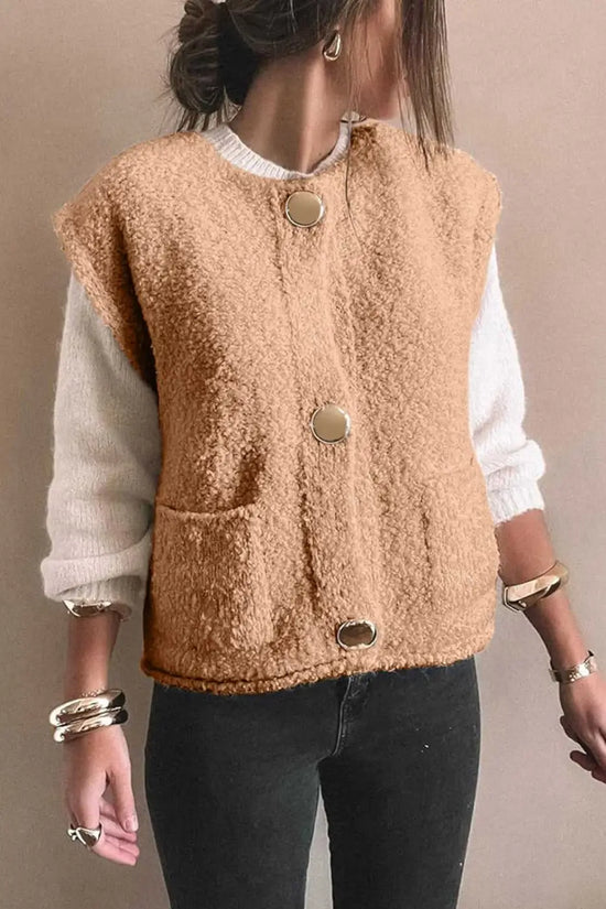 Front view of cozy beige fleece gilet featuring large gold-tone buttons and dual pockets, paired with casual winter wear.