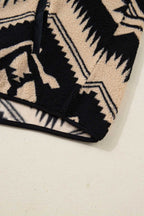 Hem detail of Women's Black Plus Size Aztec Print Plush Sweatshirt, featuring clean stitching and thick sherpa fleece for winter comfort.