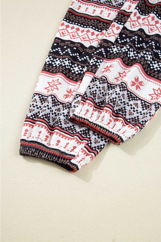 Cuffed pant leg detail of Women's Christmas Comfort Lounge Set in Black by FashionFitz, featuring elastic hem and seasonal print.