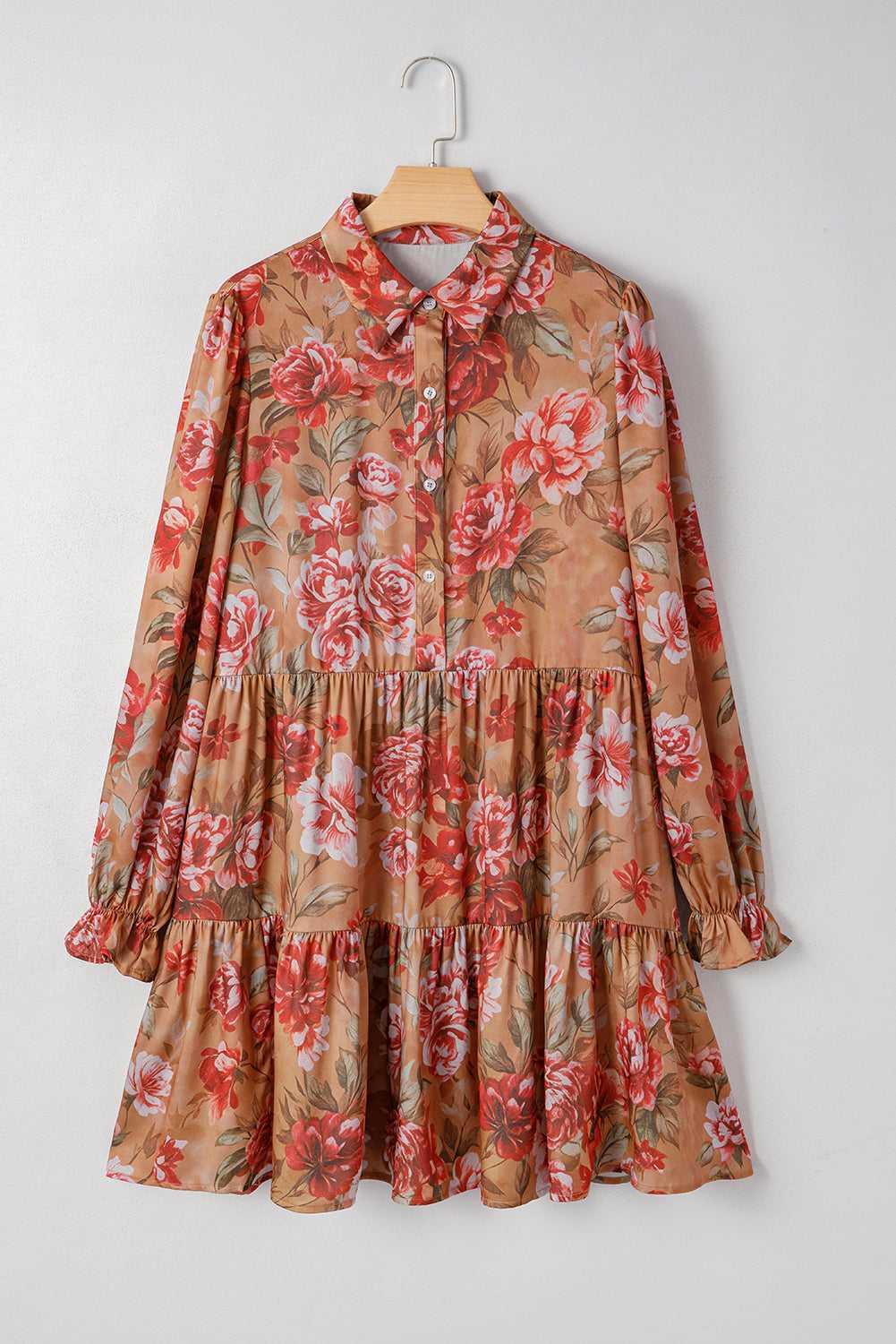 Flat lay of Retro Floral Ruffle Mini Dress in brown with red and pink floral print, featuring long sleeves and tiered skirt.