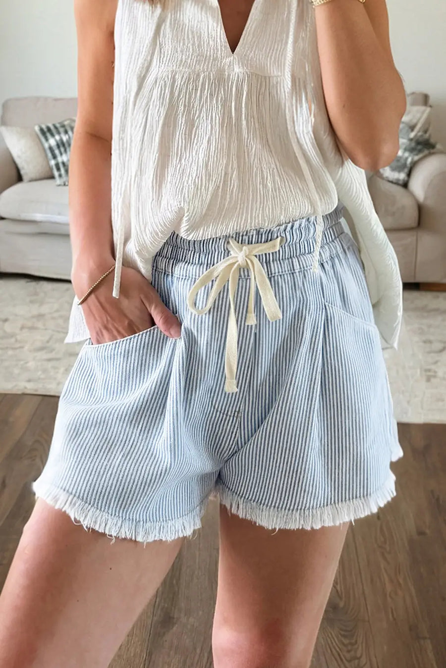 Women's drawstring denim shorts flat lay stripe casual