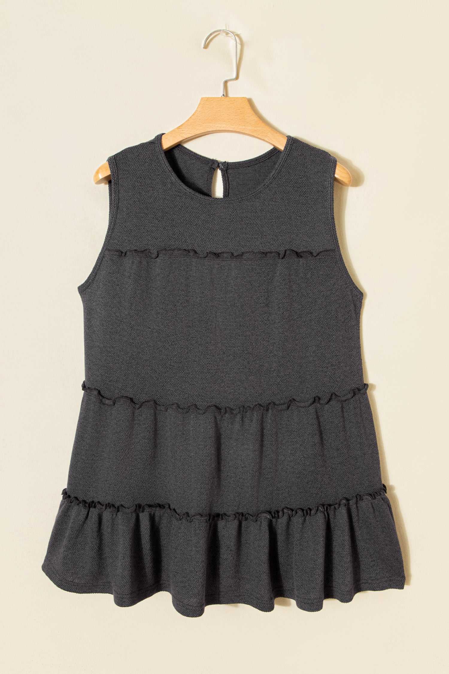 Dark grey tiered frill tank top for women on hanger, showcasing A-line silhouette and solid color design.