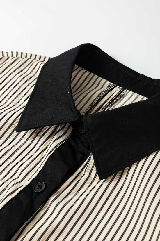 Close-up of Monochrome Striped Puff Sleeve Mini Dress collar with black contrast and vertical stripes, showcasing modern casual style.