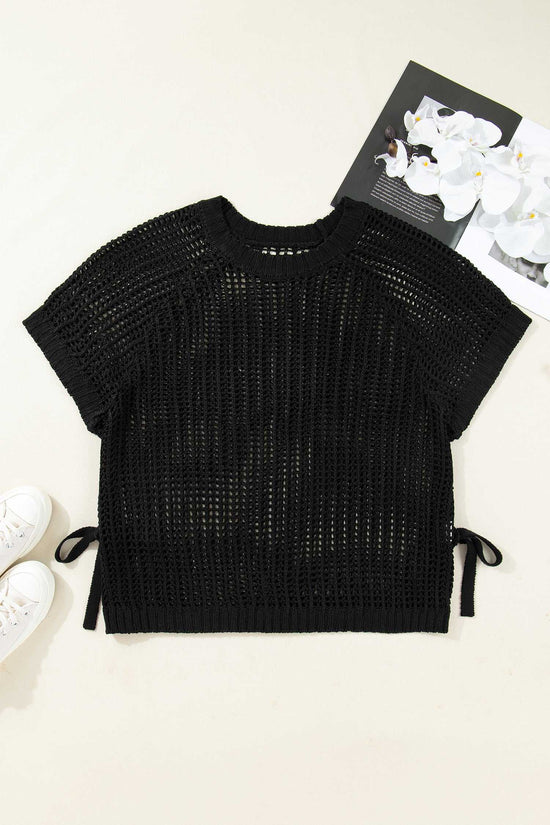 Flat lay of black Plus Size Bow Tie Open‑Knit Jumper for Women highlighting short sleeves, open-knit texture, and side bows.