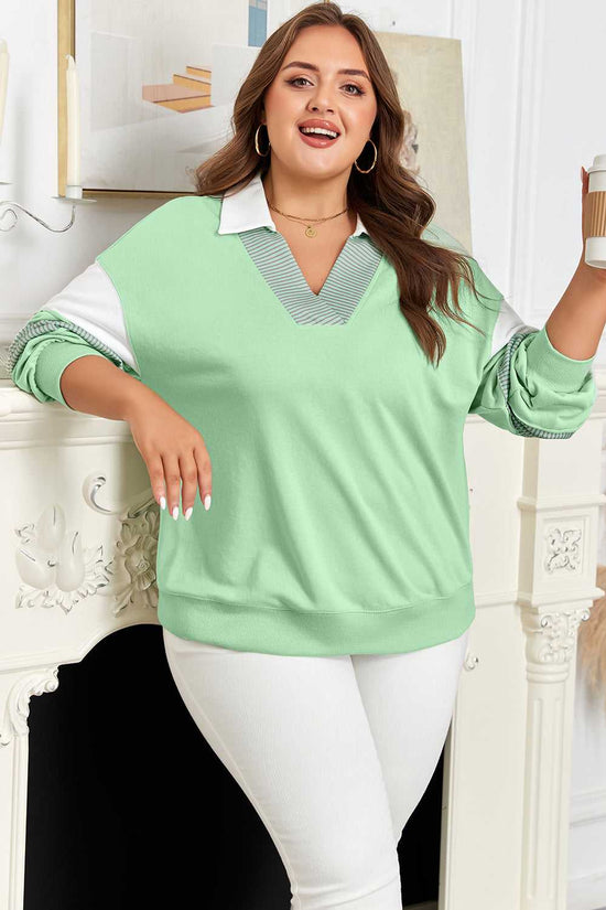Curve Jade Stripe V‑Neck Sweatshirt for Women styled casually with coffee cup, highlighting jade green color and striped sleeves.
