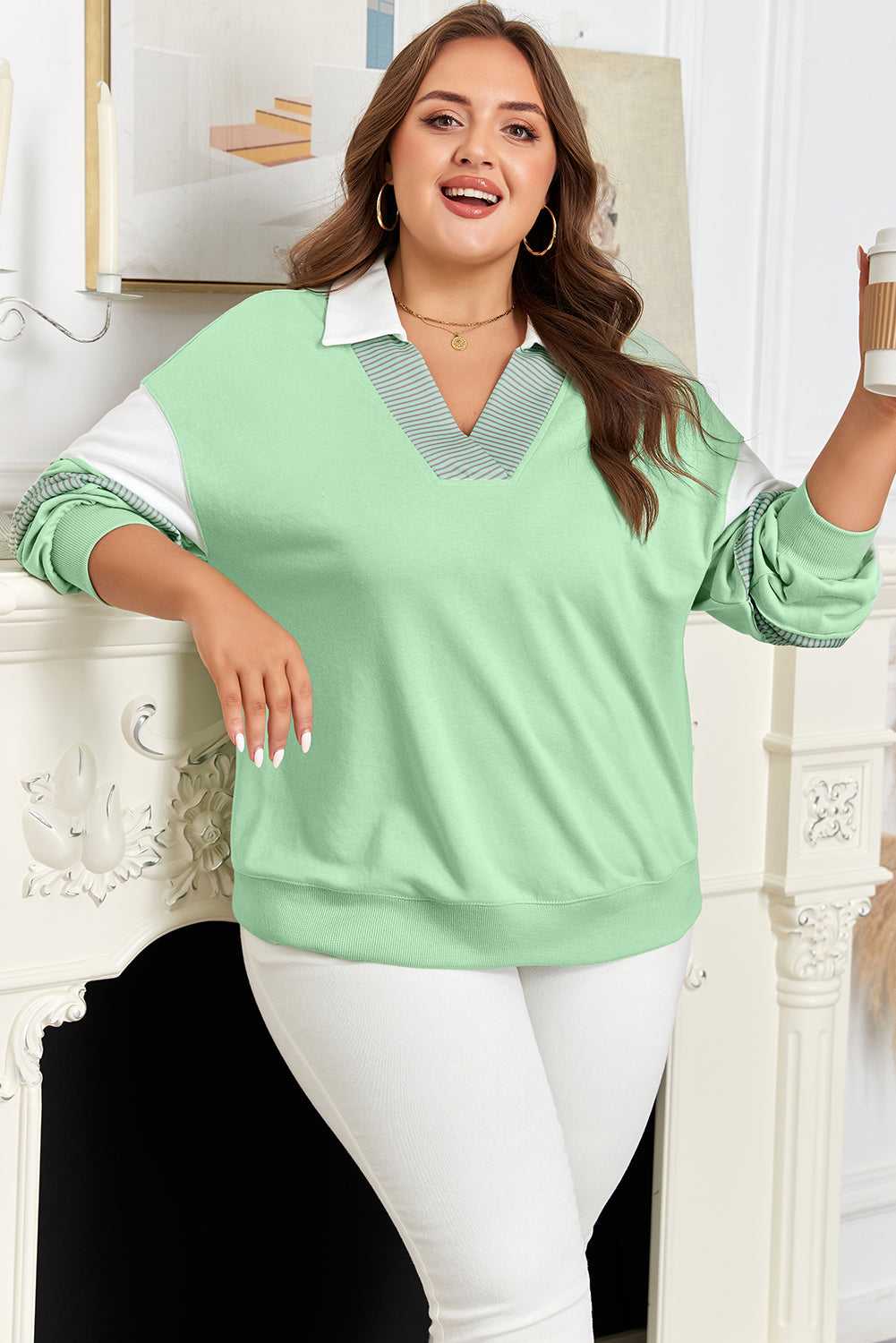 Curve Jade Stripe V‑Neck Sweatshirt for Women styled casually with coffee cup, highlighting jade green color and striped sleeves.