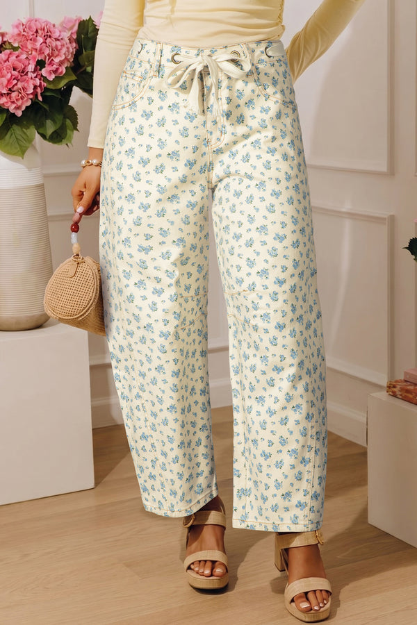 Grommet knot waist floral barrel leg jeans in beige — front view showing knot waist detail and barrel leg silhouette