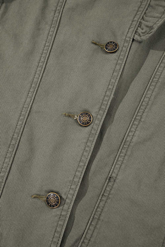 Detailed view of buttons on Green Bay Ruffled Denim Vest - Women's Fashion Trends with metallic accents and reinforced seams.