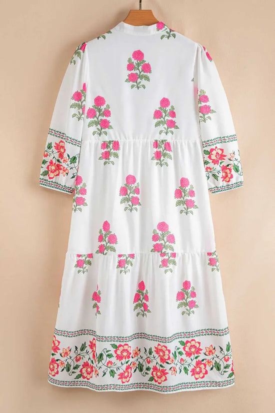 Back view of White Floral Mandarin Maxi Dress showcasing tiered design and pink floral motifs, perfect for Southern Belle style.