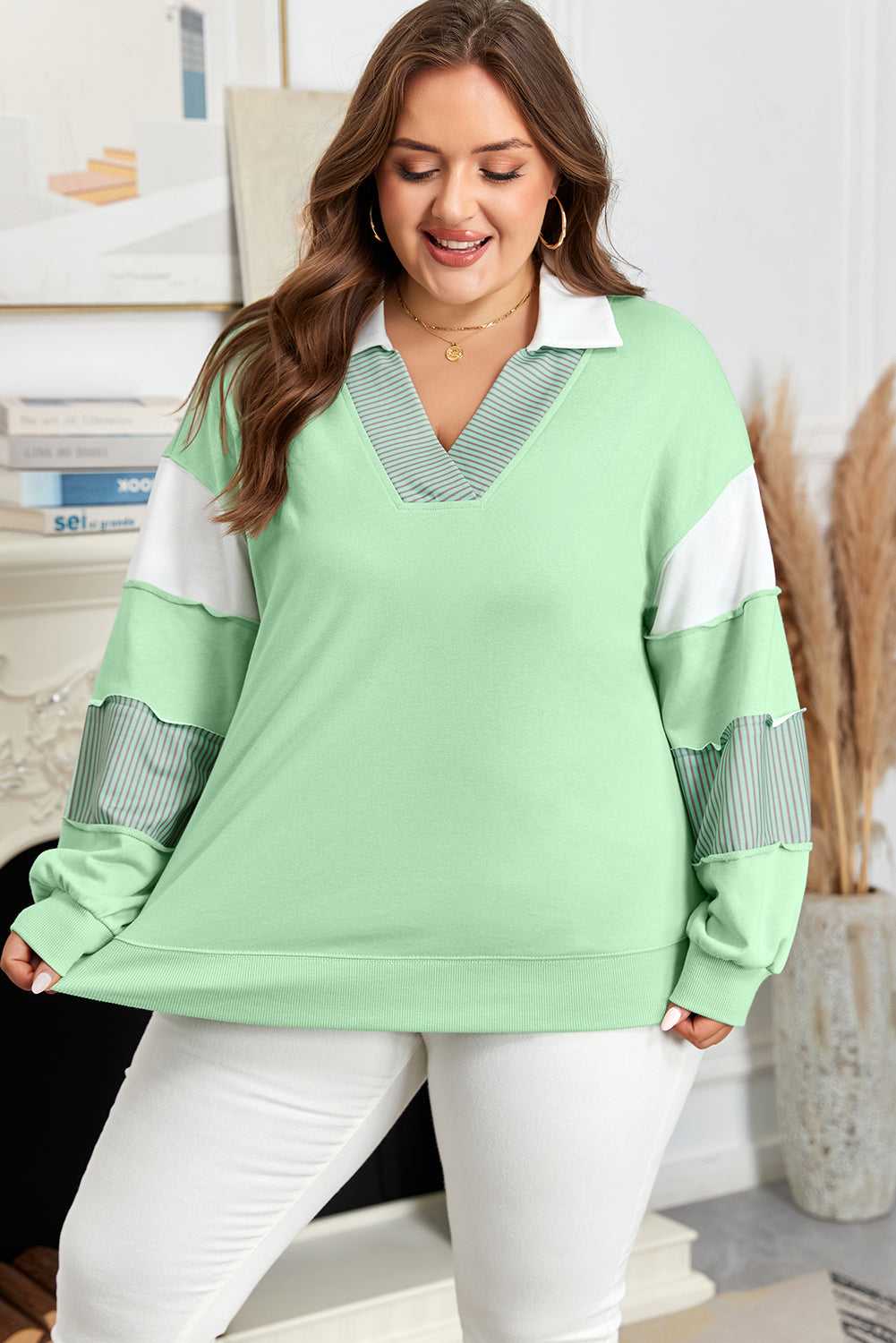 Front view of Curve Jade Stripe V‑Neck Sweatshirt for Women featuring striped V-neck detail and long sleeves with patchwork accents.