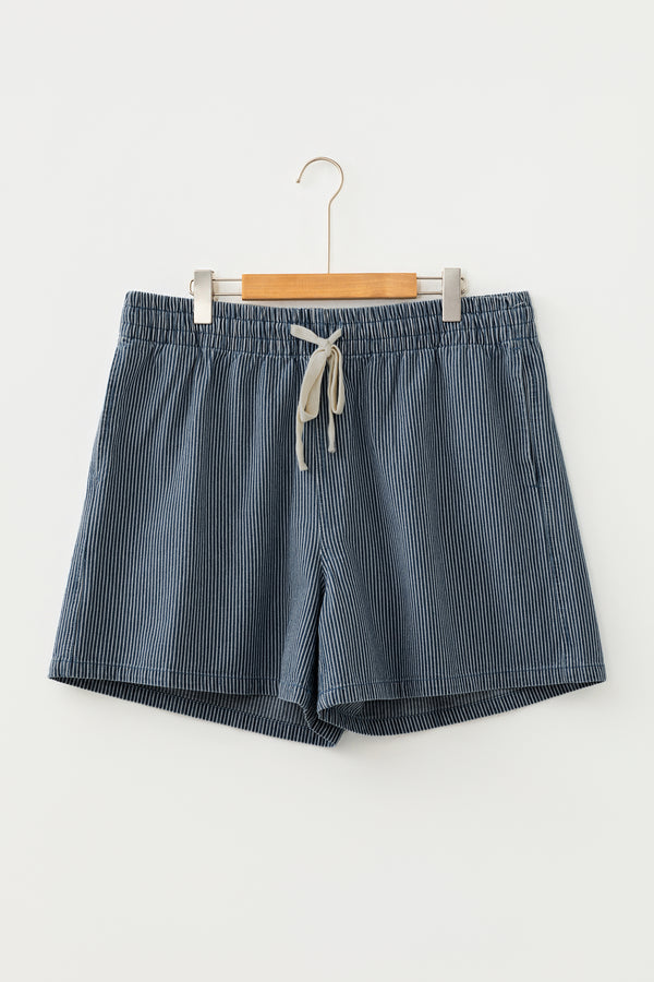 Blue plus size denim shorts — side view showing stripe contrast and drawstring waist