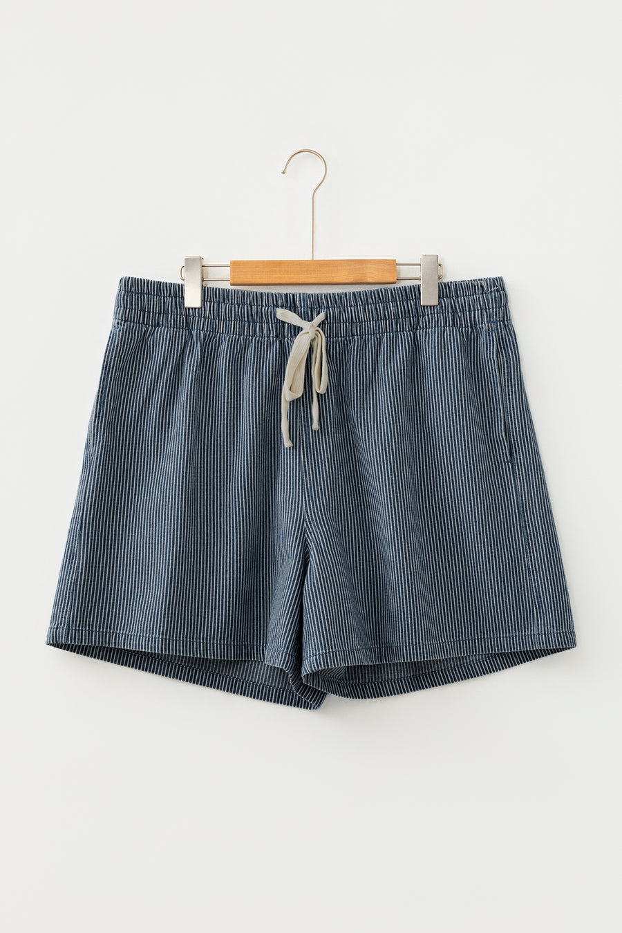 Blue plus size denim shorts — side view showing stripe contrast and drawstring waist