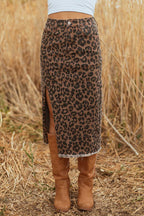 Front view of Leopard Denim Midi Skirt - Summer Fashion by FashionFitz worn with white top and brown boots in outdoor setting.