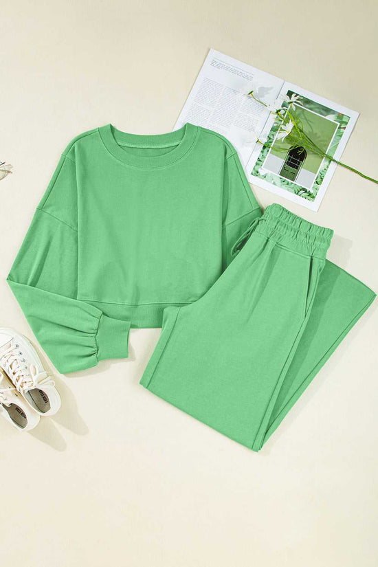 Flat lay of green Drop Crop Wide-Leg Pants Set with accessories, ideal for showcasing casual outfit styling inspiration.
