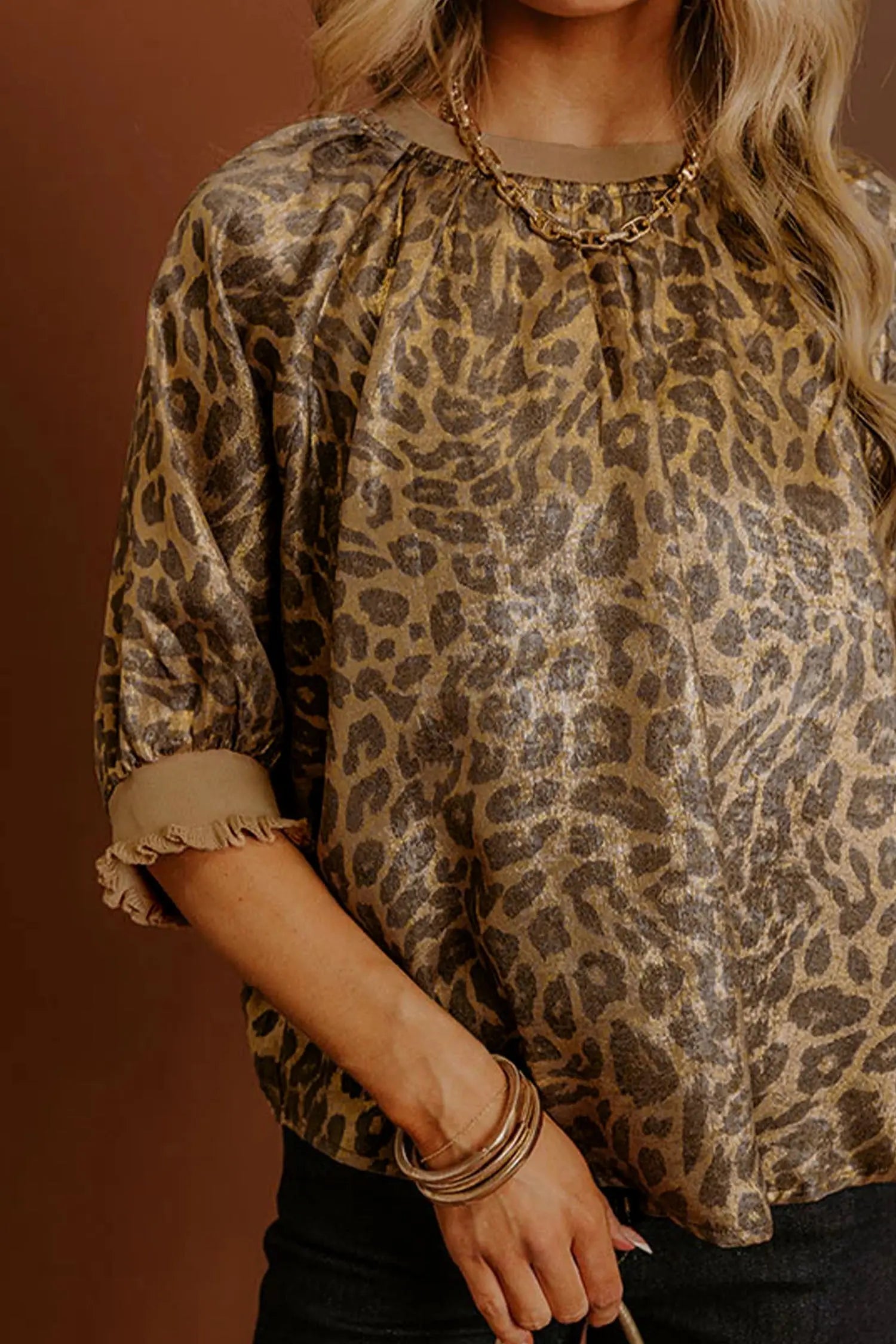 Gold metallic leopard print blouse styled for evening with heels | Fashionfitz