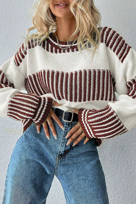 Model wearing brown striped jumper with relaxed fit and round neckline