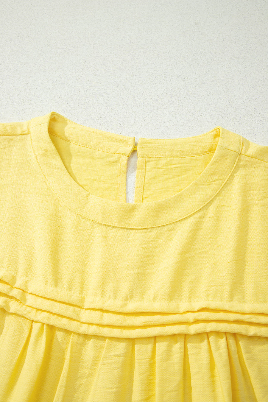 Tie Cuff Half Sleeve Pleated Babydoll Blouse — fabric texture detail | Fashionfitz UK