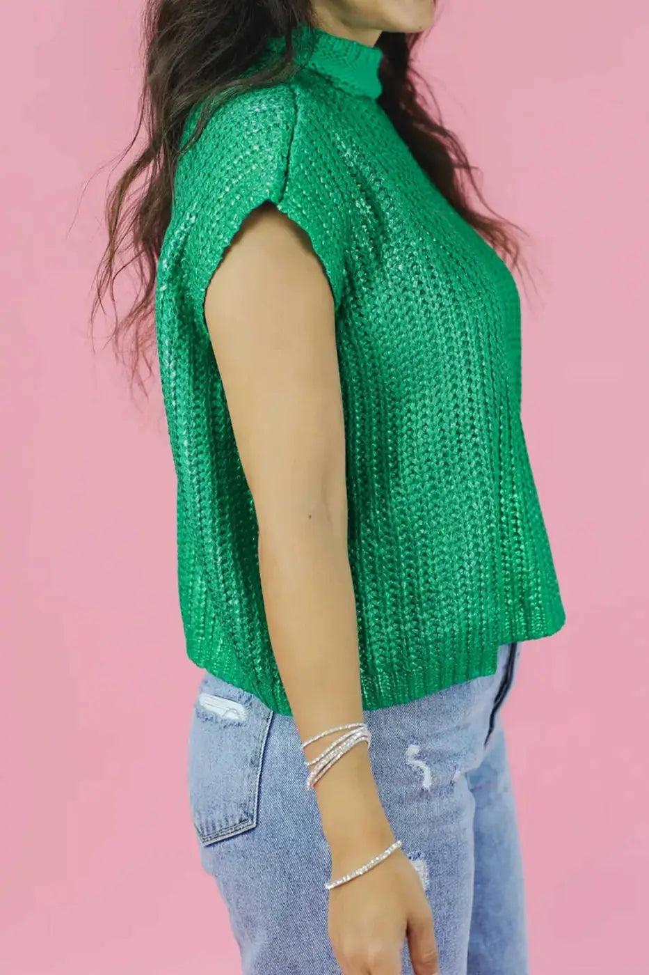Side view of green lustre knit short sleeve sweater tee for women, featuring high neckline and relaxed fit for casual summer outfits.