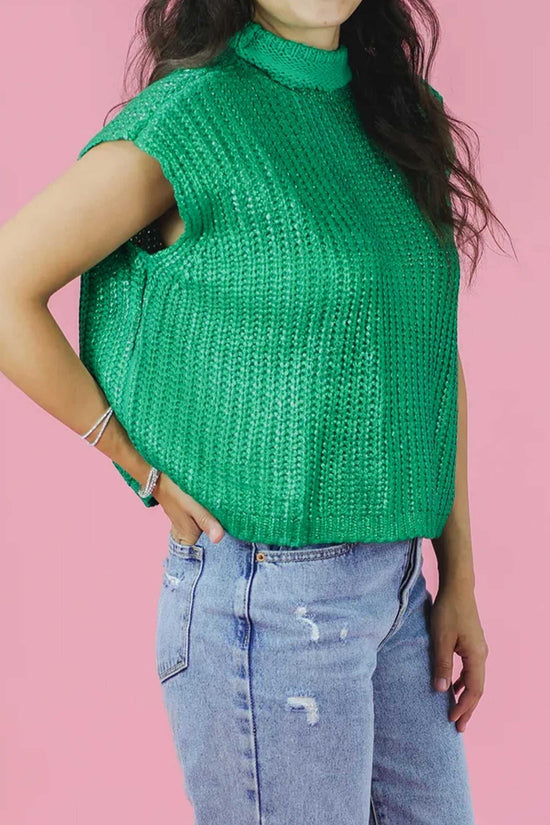 Front angled view of green high neck knit top with short sleeves, showcasing textured acrylic fabric and loose silhouette for daily wear.