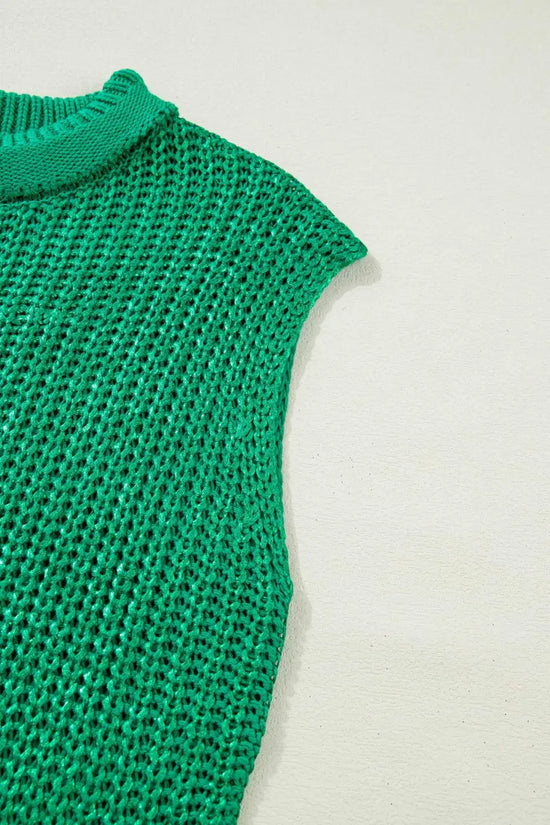 Sleeveless detail of green high neck knit top with airy acrylic weave. Lightweight summer sweater tee in a relaxed fit.