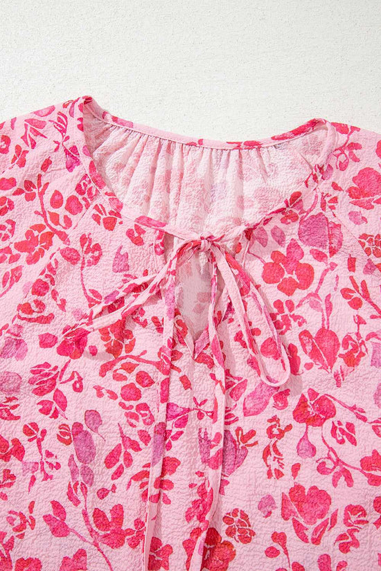 Close-up of neckline on Pink Floral Lightweight Blouse with tie detail and gathered fabric for a feminine touch.