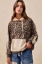 Front view of Leopard Print Waffle Knit Kangaroo Hoodie with beige accents and relaxed fit, ideal for daily fall outfits.