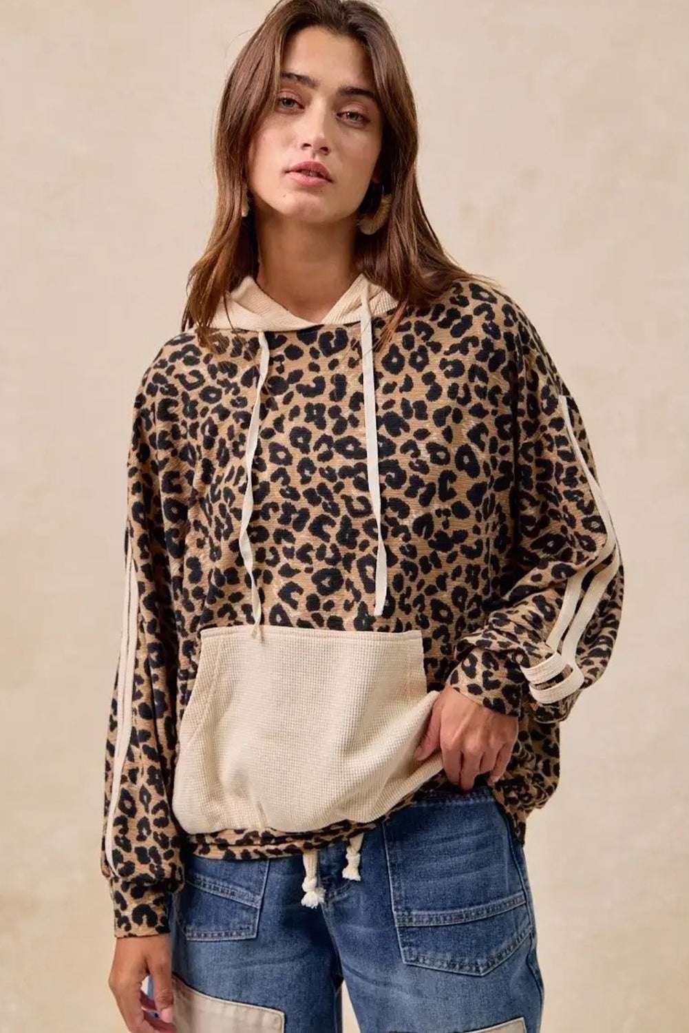 Front view of Leopard Print Waffle Knit Kangaroo Hoodie with beige accents and relaxed fit, ideal for daily fall outfits.