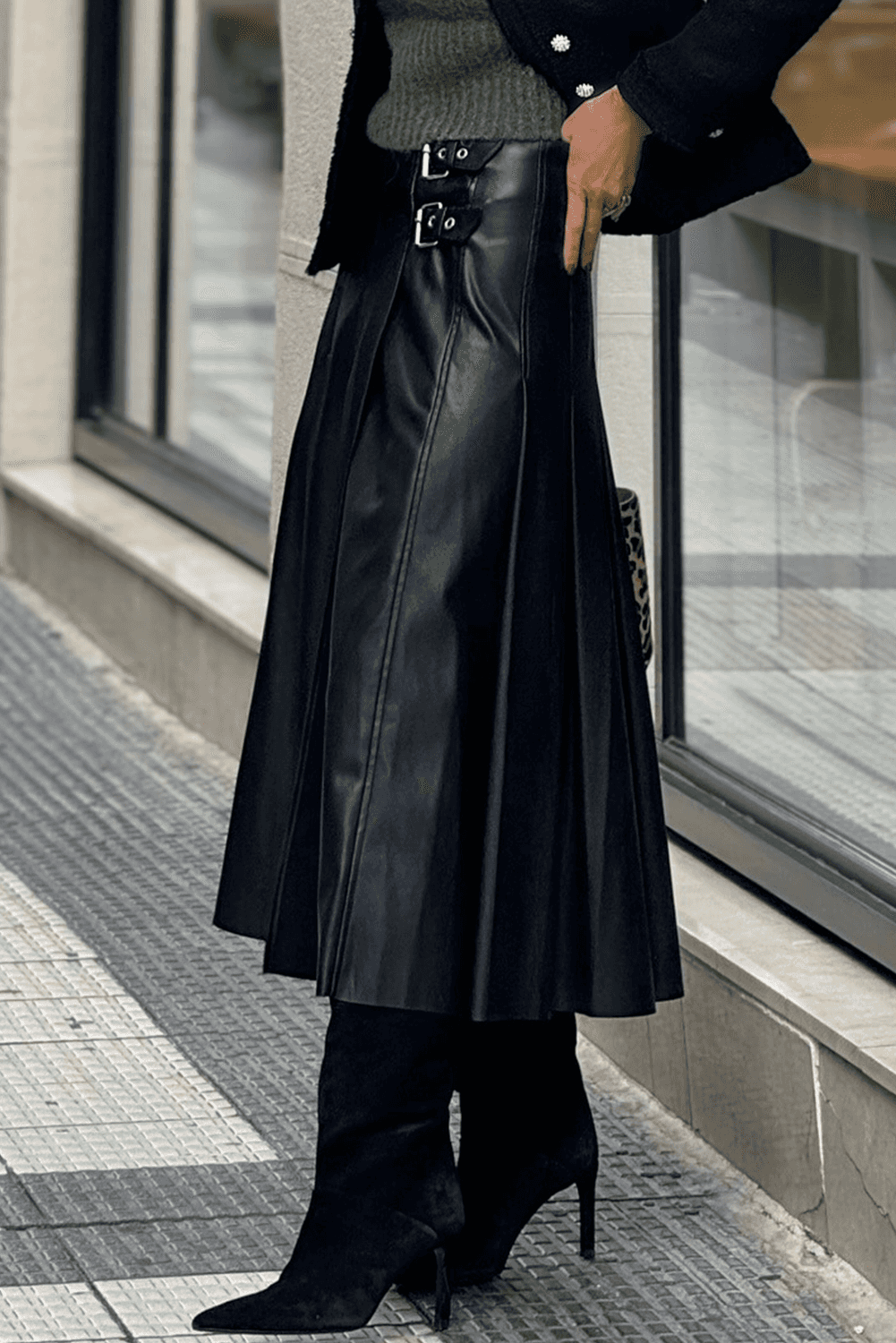 Black Faux Leather Pleated Flared Skirt | FashionFitz side view highlighting the flared silhouette and structured pleats for a modern fall look.