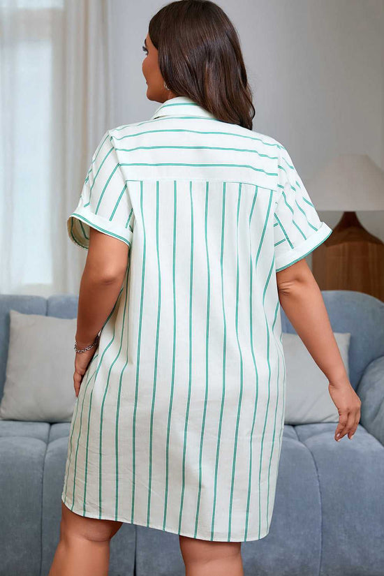 Woman wearing a green and white striped dress in a living room.