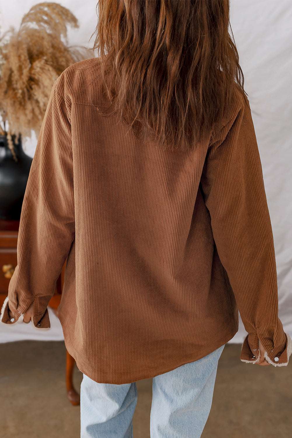 Back view of Fleece Lined Corduroy Jacket in solid brown, showcasing relaxed fit and soft corduroy texture.