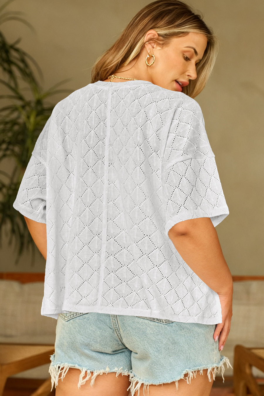 White pointelle knit plus size top — close-up of rhombus knit texture