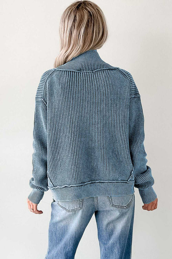 Back view of blue stonewash patchwork knit open cardigan showing ribbed knit texture and relaxed fit, perfect for fall layering.