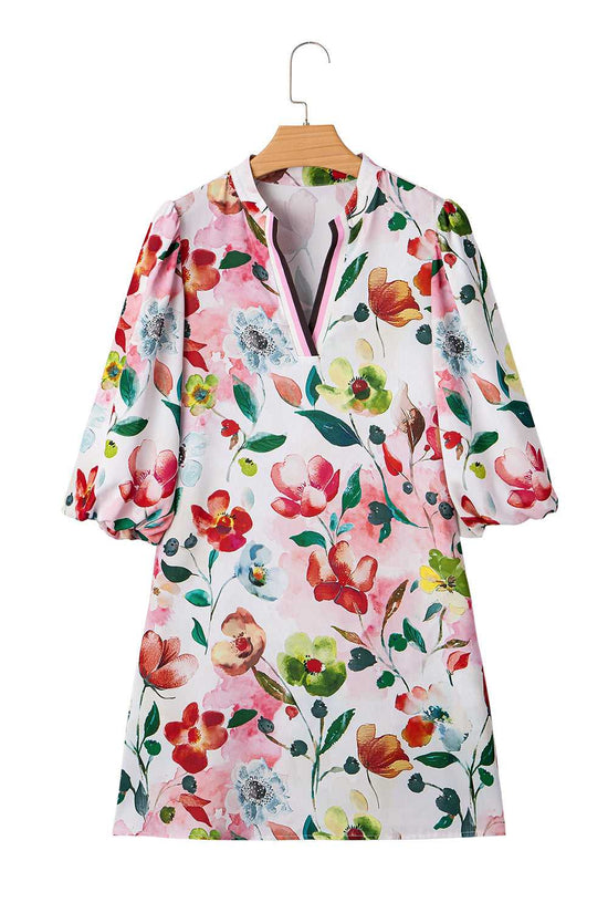 Flat lay of Floral Shift Dress - Casual Elegance on hanger, featuring puff sleeves, contrast neckline, and vibrant floral print.