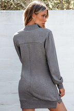 Rear view of gray zip-up sweatshirt dress showing seam details and ribbed cuffs, designed for relaxed fall fashion.