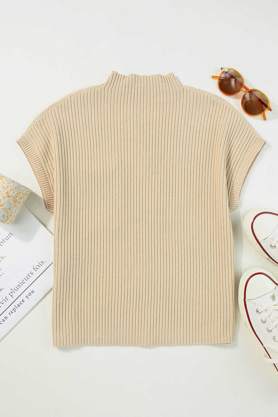 Back flat lay of oatmeal ribbed knit sweater dress showing short sleeves and mock neck, ideal for cozy winter styling.