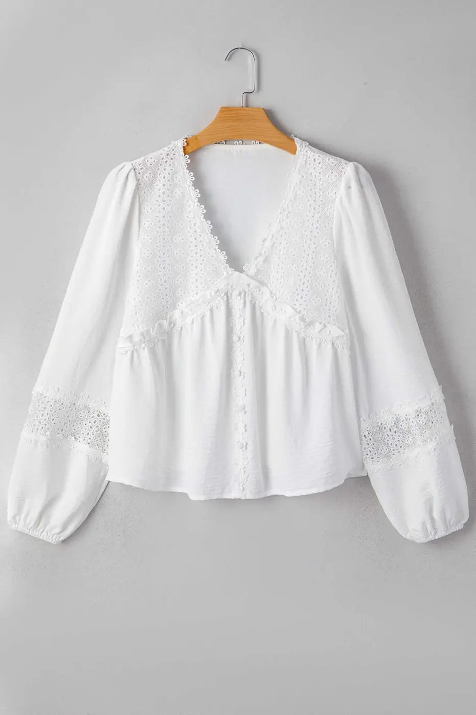 White Guipure Lace Frill Blouse on hanger showing full front view with V-neck, lace accents, and long frill sleeves for a romantic style.