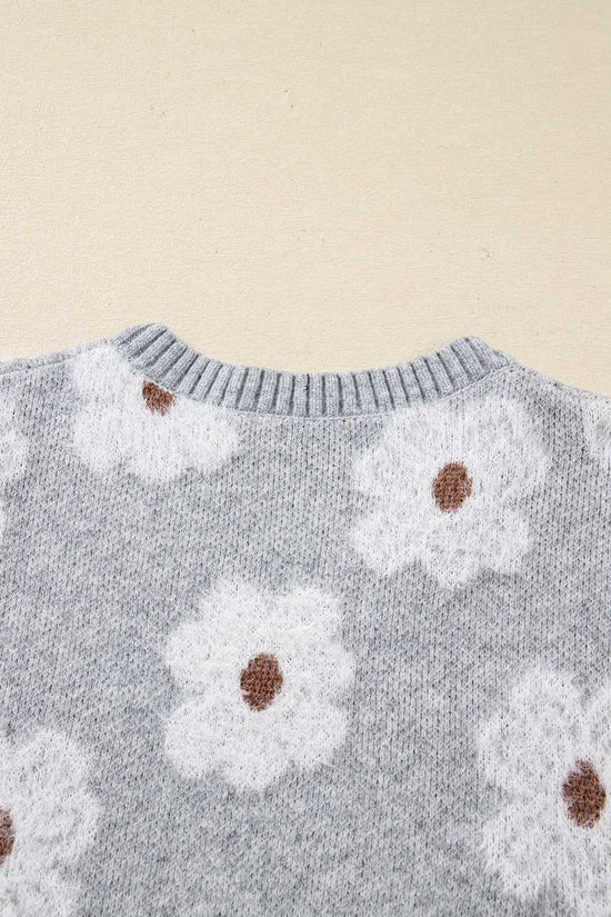Back neckline detail of FashionFitz Oversized Grey Floral Knit Jumper – V‑Neck with ribbed collar and soft floral knit texture.