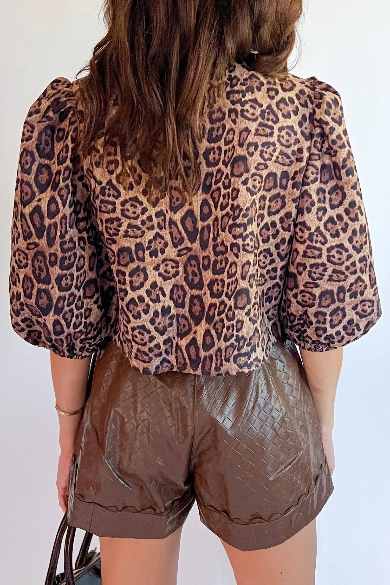 Close-up of bow tie neckline and puff sleeve detail on brown leopard print blouse Fashionfitz UK