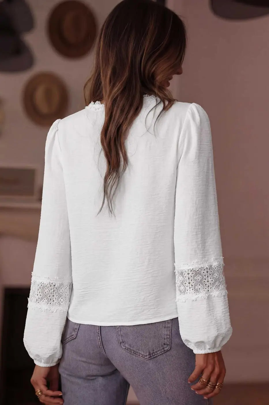 Back view of White Guipure Lace Frill Blouse showing plain back and lace-detailed long sleeves, ideal for spring and summer outfits.
