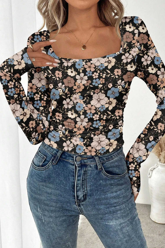 Front view of black floral slim long sleeve top featuring soft pastel floral print and fitted silhouette for everyday wear.
