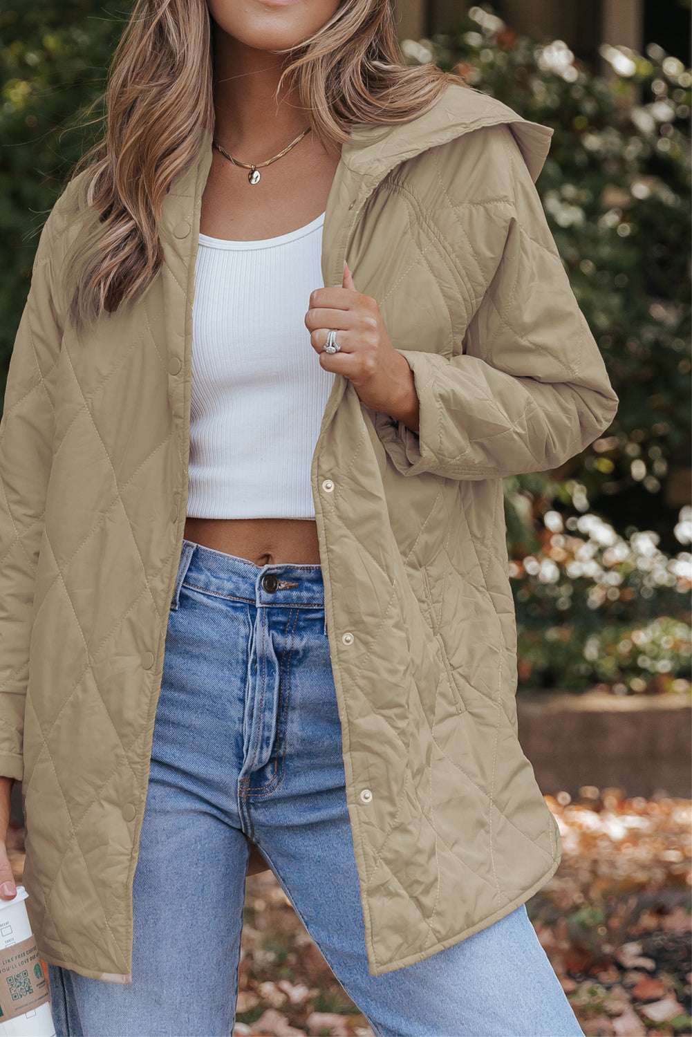 Front view of Khaki Quilted Puffer Jacket – Hooded Snap Button Coat from FashionFitz, styled with jeans and a white crop top for casual outerwear fashion.