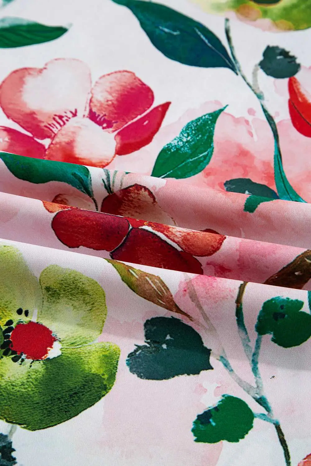 Detailed fabric view of Floral Shift Dress - Casual Elegance, highlighting vivid watercolor floral print and soft summer texture.