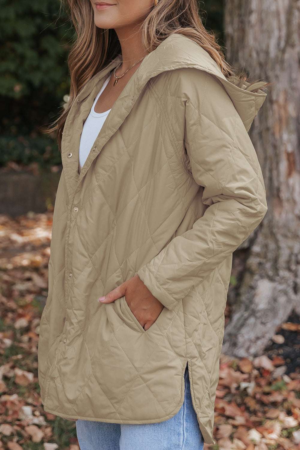 Side profile of Khaki Quilted Puffer Jacket – Hooded Snap Button Coat featuring side pockets and curved hem, perfect for cozy autumn style.