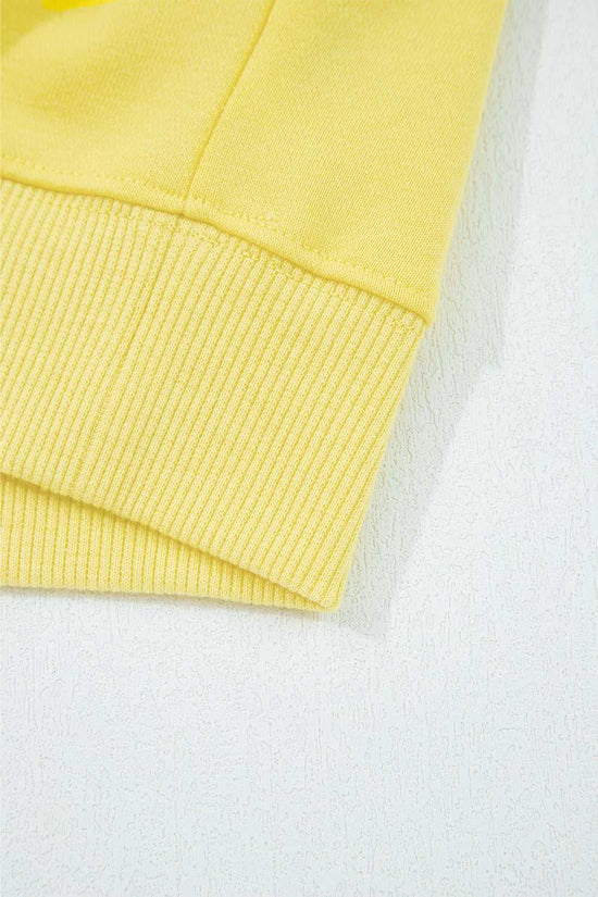 Hem detail of yellow Drop Crop Wide-Leg Pants Set top, showing ribbed edge for a polished loungewear look.
