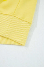 Hem detail of yellow Drop Crop Wide-Leg Pants Set top, showing ribbed edge for a polished loungewear look.