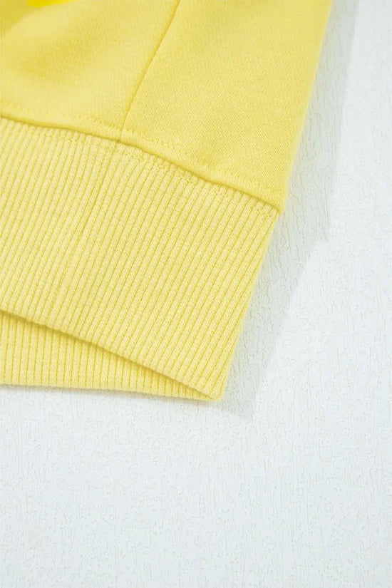 Hem detail of yellow Drop Crop Wide-Leg Pants Set top, showing ribbed edge for a polished loungewear look.