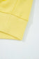 Hem detail of yellow Drop Crop Wide-Leg Pants Set top, showing ribbed edge for a polished loungewear look.