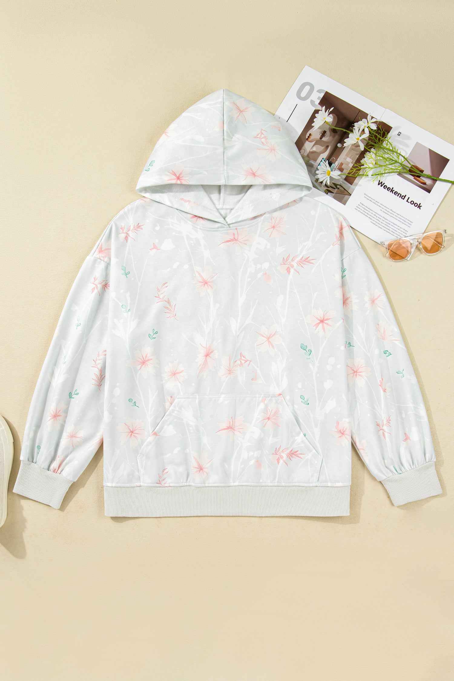 Flat lay of Curve Floral Print Hoodie in grey with pink floral design, showing hood, long sleeves, and front pocket for casual plus size wear.