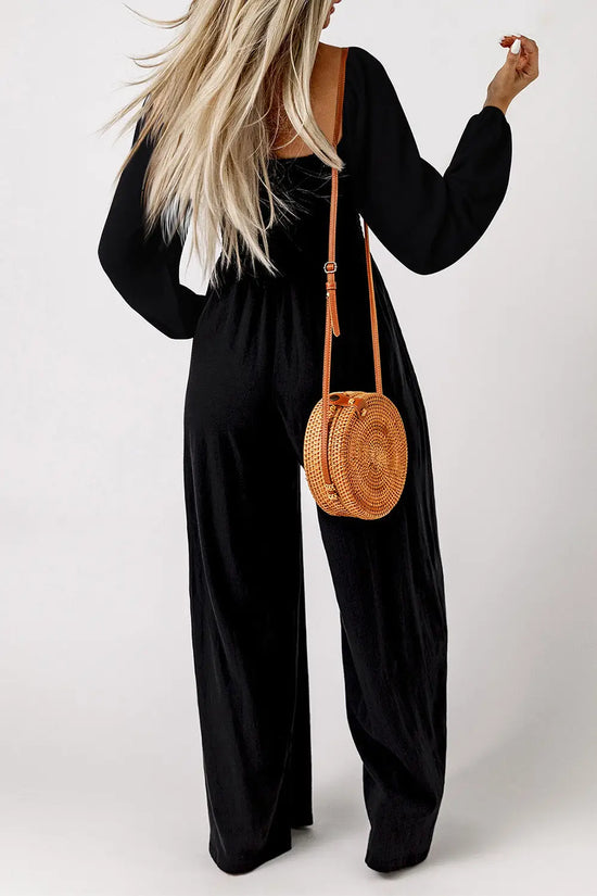 Side view of smocked wide leg jumpsuit showing flowy silhouette and long sleeves Fashionfitz UK
