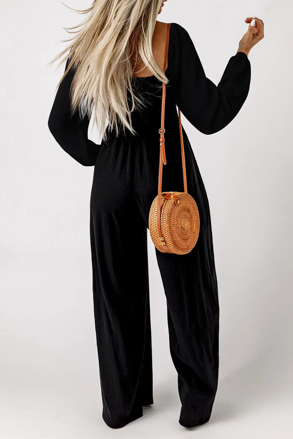 Side view of smocked wide leg jumpsuit showing flowy silhouette and long sleeves Fashionfitz UK